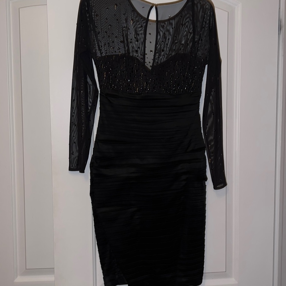 Worn once. Form fitting dress. Perfect for New Years